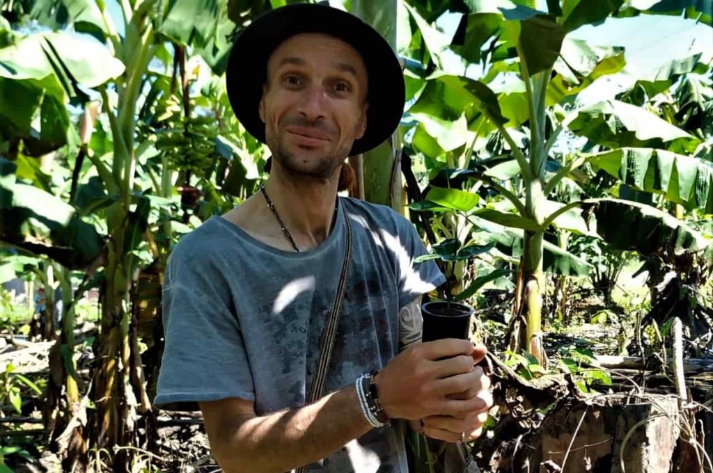 A traveler enjoys a reforestation workshop in Nuevo Eden