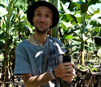 A traveler enjoys a reforestation workshop in Nuevo Eden